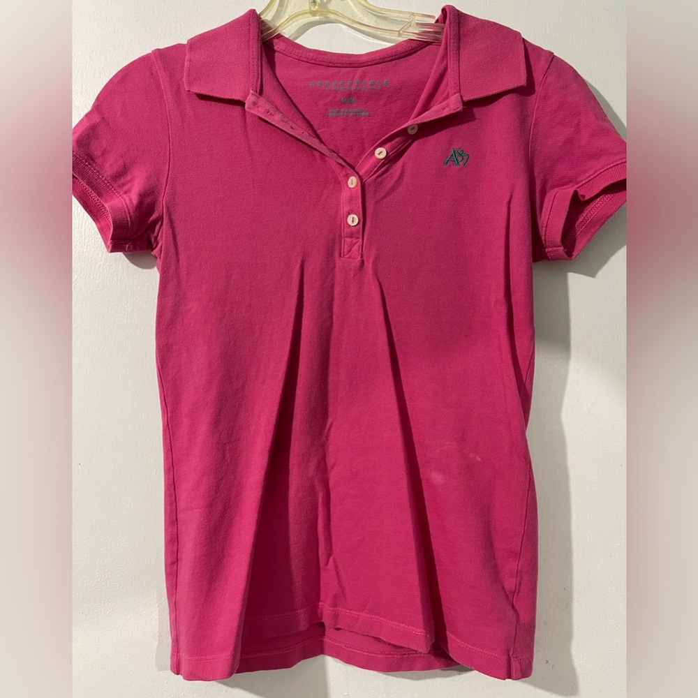Pink polo.